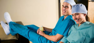 Smiling Doctors in scrubs happy with better pay rates rom jobs with Mercury Medical Recruitment