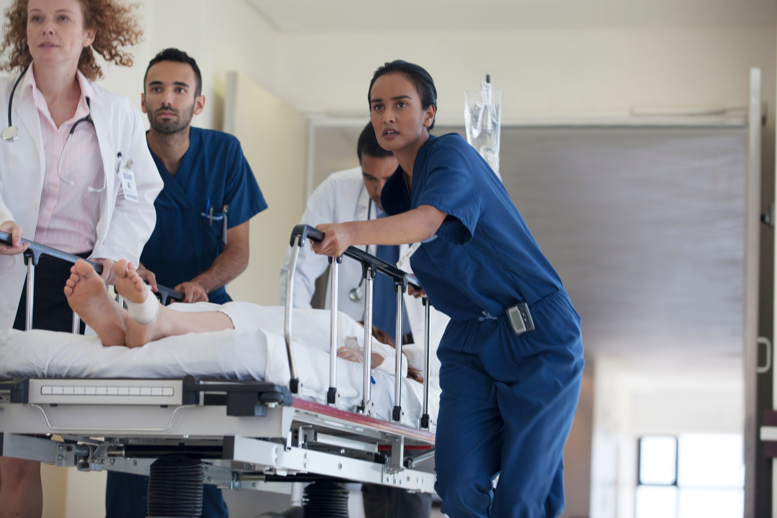 Hospital staff rushing patient to operating room